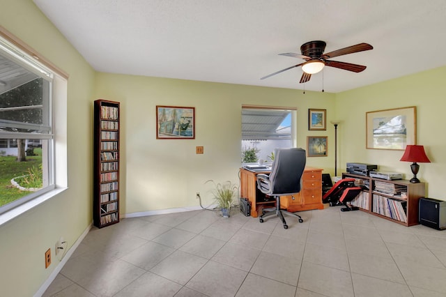 tiled home office with ceiling fan