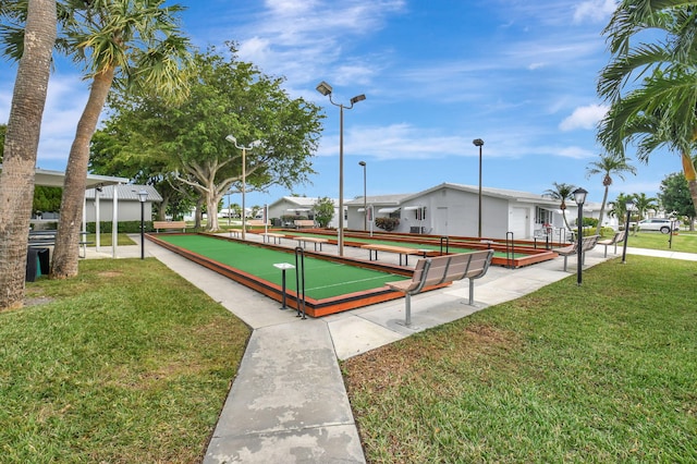 view of home's community featuring a lawn