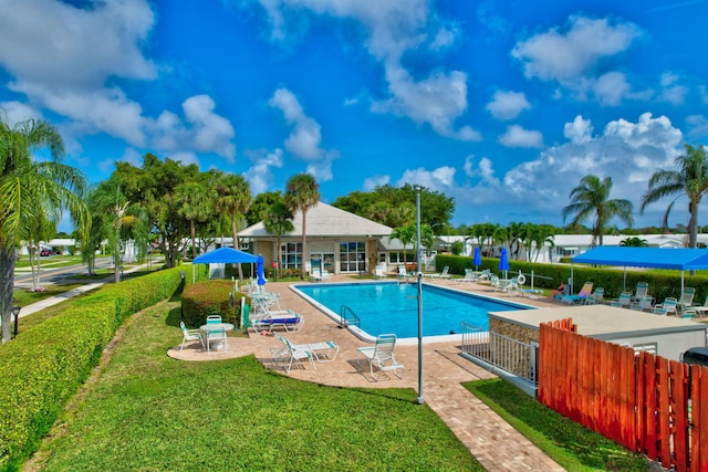 view of pool with a yard and a patio area