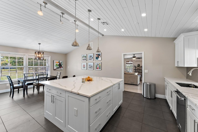 kitchen with pendant lighting, dishwasher, sink, white cabinets, and a center island