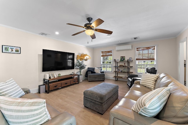 living room featuring crown molding, a wall mounted air conditioner, ceiling fan, and light hardwood / wood-style floors