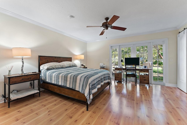 bedroom with ornamental molding, access to outside, ceiling fan, a barn door, and light hardwood / wood-style flooring