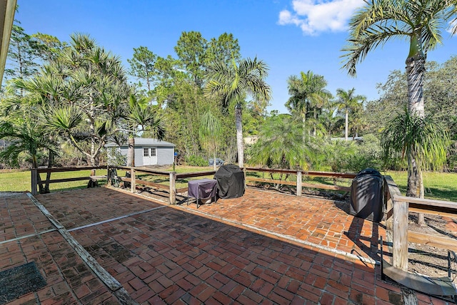 view of patio with a shed