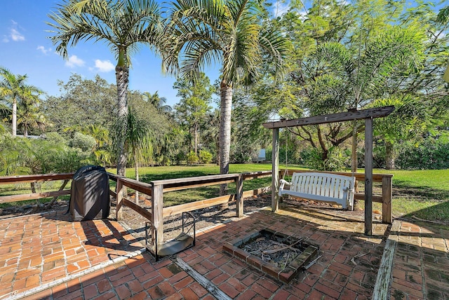 view of patio / terrace with an outdoor fire pit