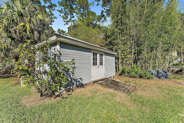 view of outdoor structure with a lawn