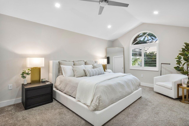 carpeted bedroom featuring vaulted ceiling and ceiling fan