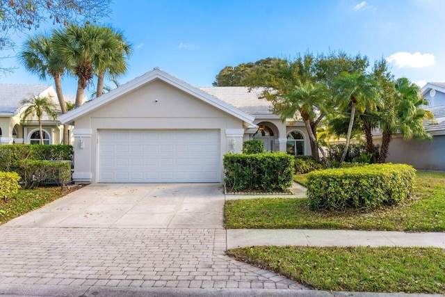 single story home featuring a garage