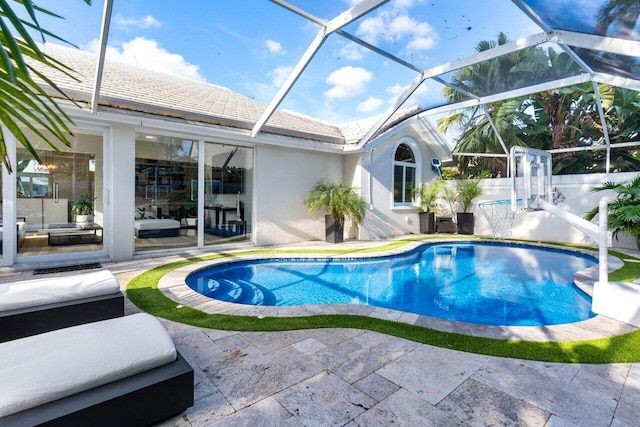 view of pool featuring a lanai and a patio