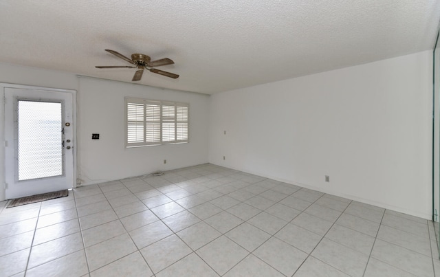 interior space featuring a textured ceiling and ceiling fan