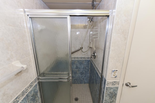 bathroom featuring an enclosed shower