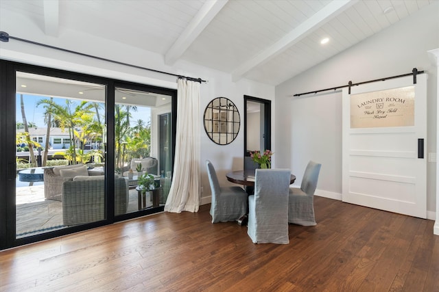 dining area featuring vaulted ceiling with beams, a barn door, baseboards, and wood-type flooring