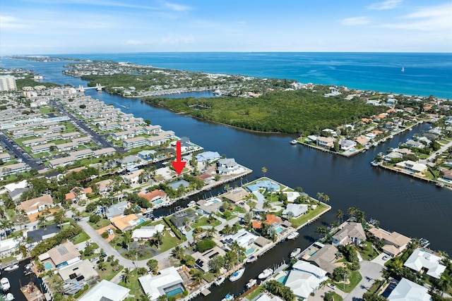 bird's eye view with a residential view and a water view