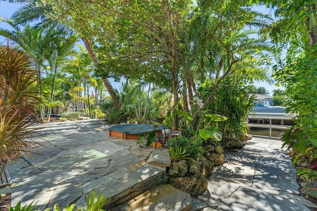 view of patio with a hot tub