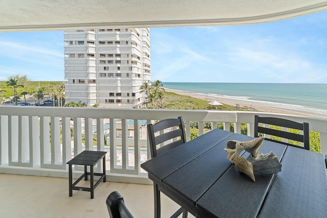 balcony with a view of the beach and a water view