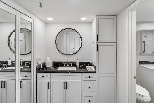 bathroom with vanity and toilet