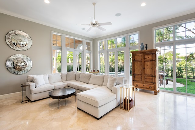 living room with ornamental molding, french doors, and ceiling fan