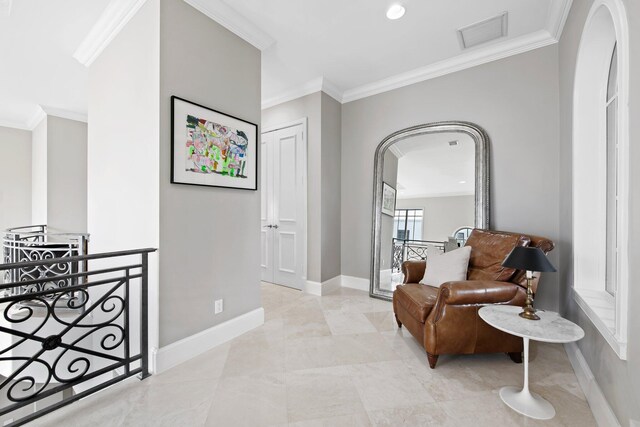 475 NE 4th St, Boca Raton, FL 33432 - living area with visible vents, arched walkways, baseboards, an upstairs landing, and ornamental molding