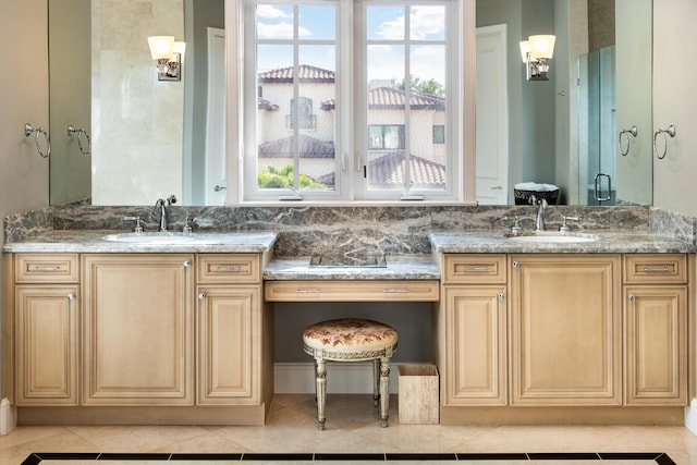 bathroom with tile patterned floors, vanity, and a shower with shower door