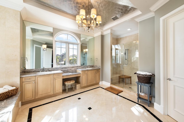 bathroom featuring an inviting chandelier, a tray ceiling, ornamental molding, and walk in shower