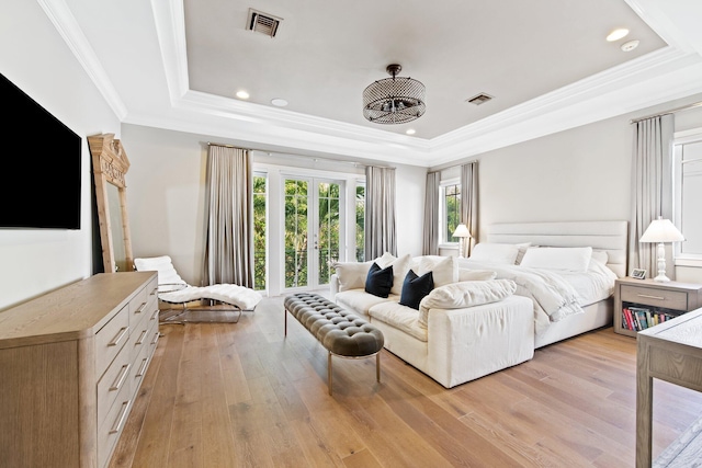 475 NE 4th St, Boca Raton, FL 33432 - bedroom featuring french doors, visible vents, light wood-type flooring, ornamental molding, and a tray ceiling