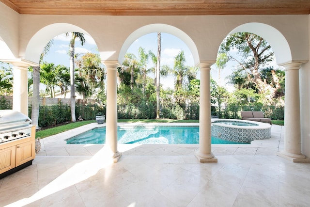 view of swimming pool with an outdoor kitchen, a patio, an in ground hot tub, and grilling area