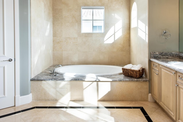 475 NE 4th St, Boca Raton, FL 33432 - bathroom featuring vanity, a garden tub, and tile patterned floors