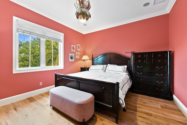 475 NE 4th St, Boca Raton, FL 33432 - bedroom with light wood-style floors, ornamental molding, baseboards, and visible vents