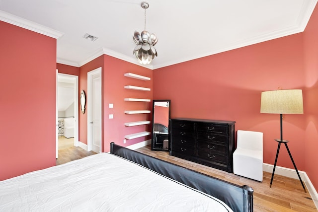 475 NE 4th St, Boca Raton, FL 33432 - bedroom featuring visible vents, crown molding, wood finished floors, baseboards, and a notable chandelier