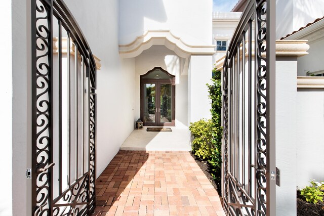 475 NE 4th St, Boca Raton, FL 33432 - doorway to property with french doors and stucco siding