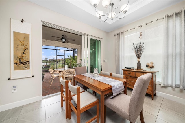 9597 SW Royal Poinciana Dr, Port Saint Lucie, FL 34987 - tiled dining space with a raised ceiling and ceiling fan with notable chandelier