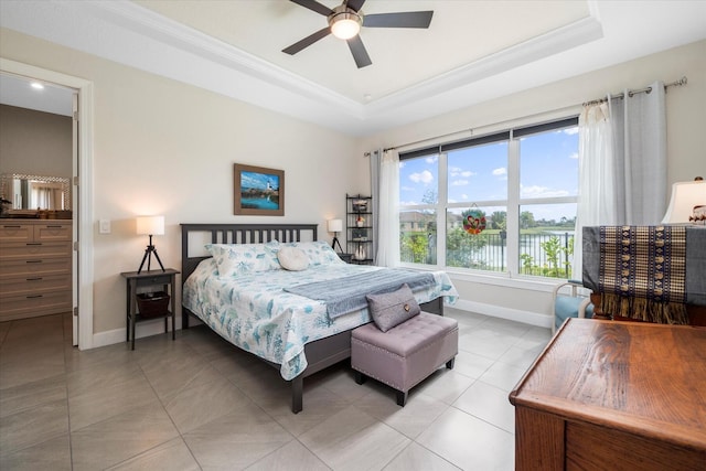 9597 SW Royal Poinciana Dr, Port Saint Lucie, FL 34987 - tiled bedroom featuring a tray ceiling, ornamental molding, and ceiling fan