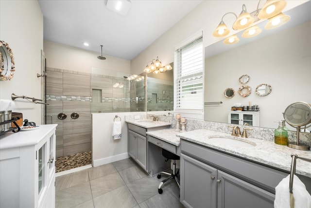 9597 SW Royal Poinciana Dr, Port Saint Lucie, FL 34987 - bathroom featuring tile patterned flooring, vanity, and a tile shower