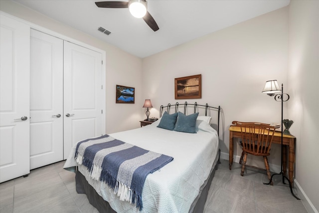 9597 SW Royal Poinciana Dr, Port Saint Lucie, FL 34987 - bedroom with ceiling fan, tile patterned floors, and a closet