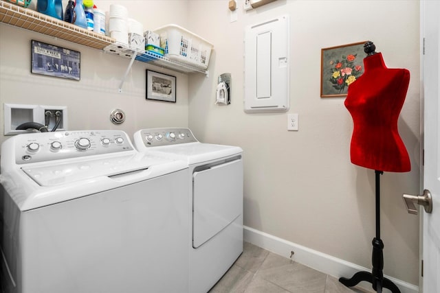 9597 SW Royal Poinciana Dr, Port Saint Lucie, FL 34987 - clothes washing area featuring electric panel, washer and clothes dryer, and light tile patterned floors