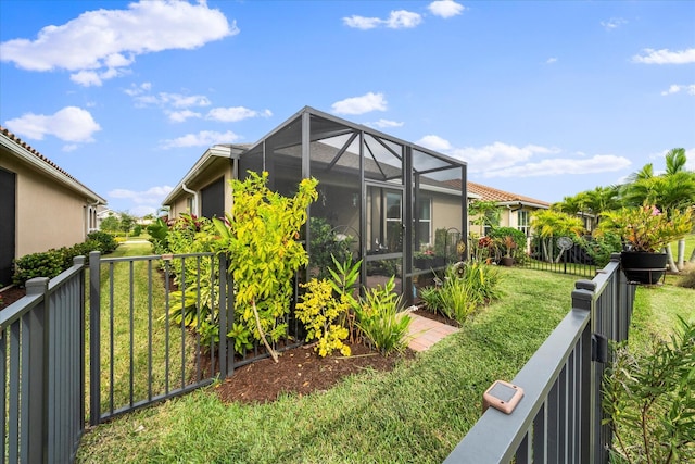 9597 SW Royal Poinciana Dr, Port Saint Lucie, FL 34987 - view of property exterior featuring a yard and a lanai
