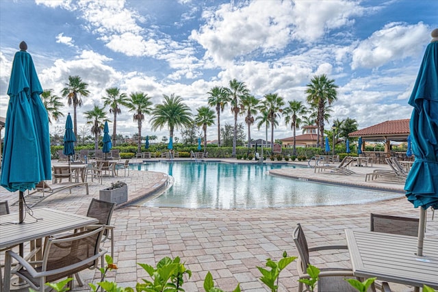 9597 SW Royal Poinciana Dr, Port Saint Lucie, FL 34987 - view of pool with a patio area