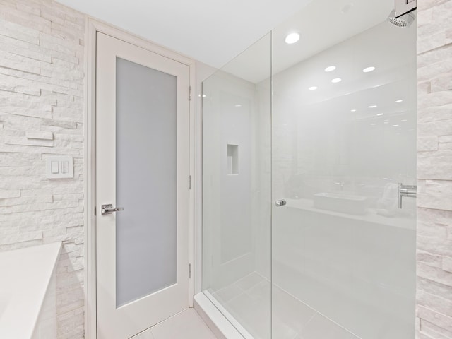 bathroom featuring tile patterned floors and walk in shower