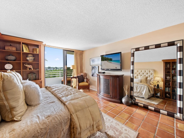 bedroom featuring light tile patterned flooring and a textured ceiling