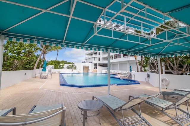 view of swimming pool with a patio area