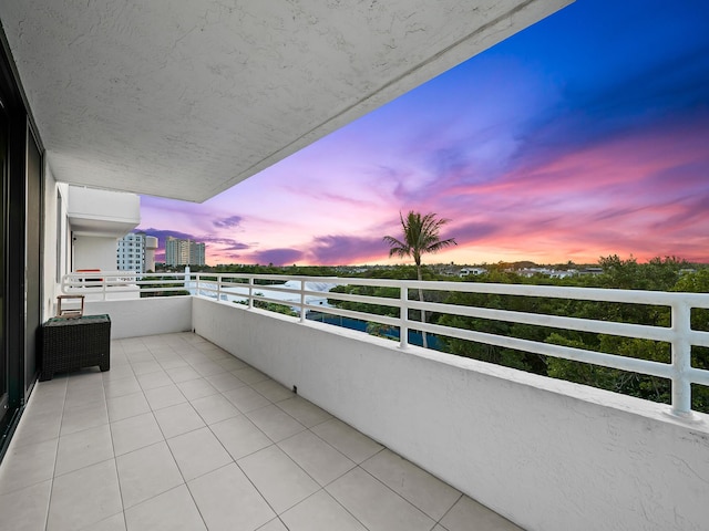 view of balcony at dusk