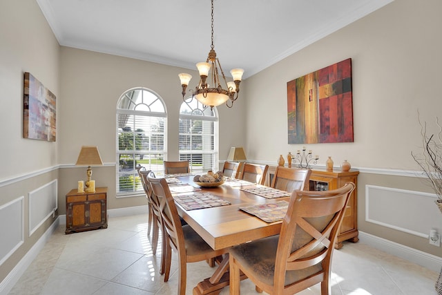 tiled dining room with ornamental molding and a notable chandelier