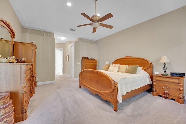 bedroom with light carpet and ceiling fan