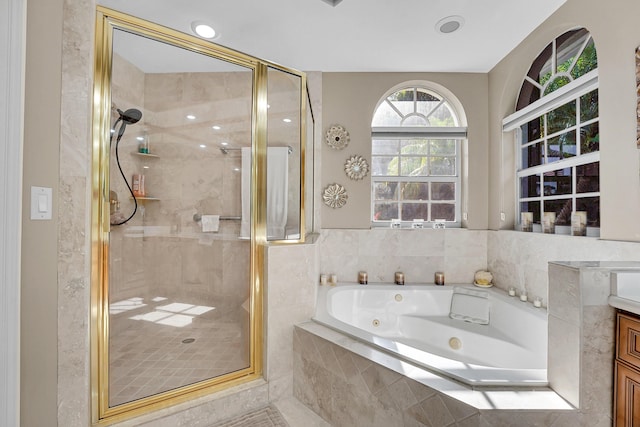 bathroom featuring vanity and separate shower and tub