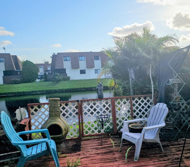 wooden deck featuring a water view