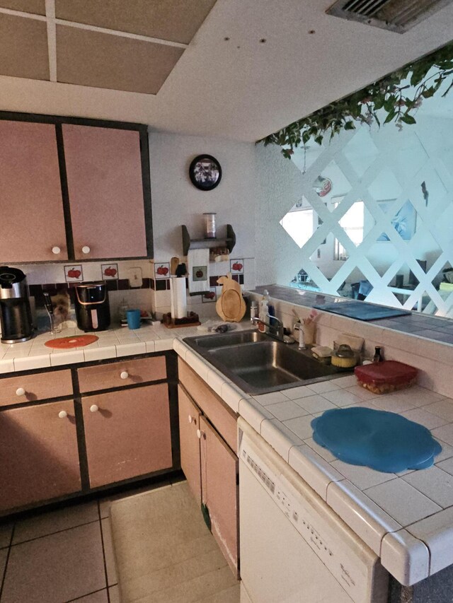 bathroom featuring tile patterned floors, vanity, and toilet