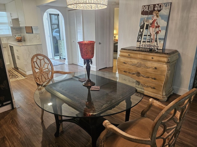 dining room with dark hardwood / wood-style flooring