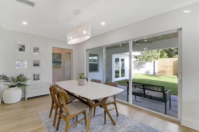 dining room with light wood-style flooring, recessed lighting, visible vents, and ceiling fan