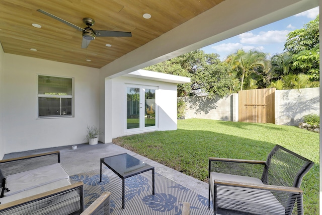 view of patio / terrace featuring french doors, outdoor lounge area, a ceiling fan, and fence