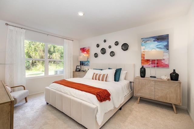 bedroom with light colored carpet