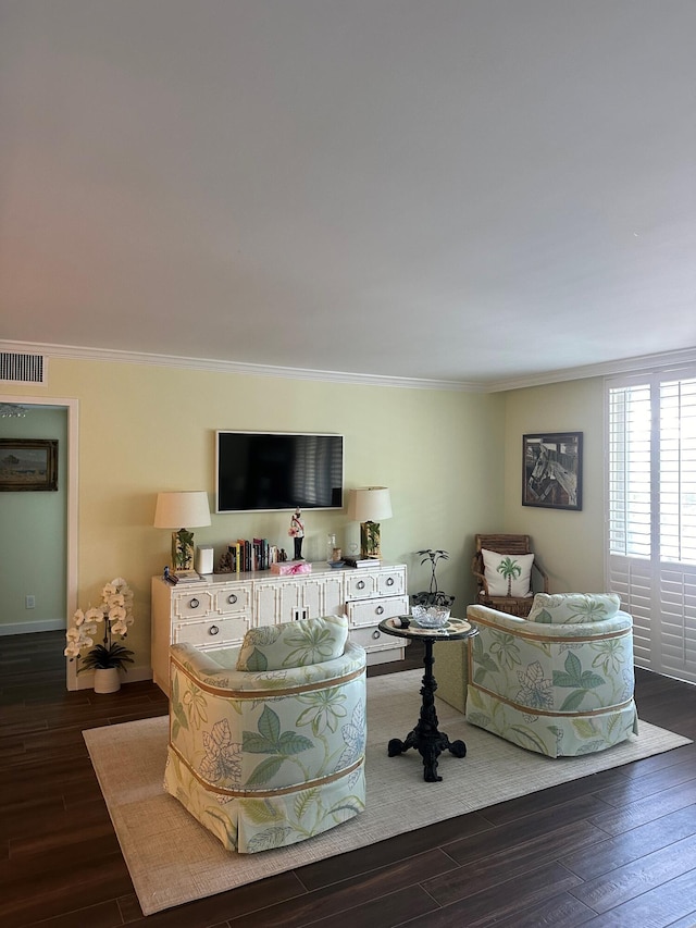 living room with crown molding and dark wood-type flooring